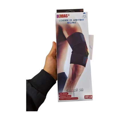 Coudière réglable Berbas, couleur [Couleur de la coudière], conçue pour le soutien et le soulagement de la douleur au coude. Présente sur l'image, elle est fabriquée dans un matériau [Type de matériau] et possède [Décrire les éléments visibles : sangles, fermetures velcro, etc.]. Destinée à aider en cas de tendinite ou de syndrome du canal cubital.