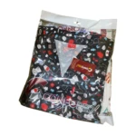 Tenue de bloc noire Confoped pour professionnels de santé : haut et bas assortis en coton/polyester avec un motif médical subtil. Confortable et élégante, disponible en plusieurs tailles.